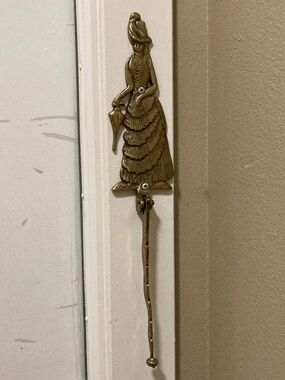 vintage woman's leg brass door knocker